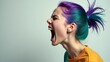 © Trushchenko_O - Young woman with vibrant teal and purple hair screams passionately, showcasing her expressive features against a plain light background