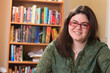 © Connect Images - Portrait of a woman with Asperger syndrome and her books