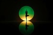 © SayedMahbub - Silhouette of a person in yoga tree pose with a green neon sun silhouette meditation wellness reflection exercise lifestyle spirituality mindfulness strength stretching wellbeing creative