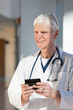 © Connect Images - Doctor text messaging on his smartphone