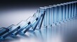 © Ridwan_DigitalGrid - Chain reaction of falling transparent glass dominos on a reflective surface representing business risk cascading failure and strategic consequences