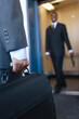 © Connect Images - Close up of a business man holding a briefcase