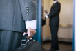 © Connect Images - Businessman holding a briefcase
