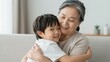 © Studicon - Loving embrace between grandmother and grandson shows bond of family love and affection