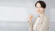© noonekoon - Confident Japanese businesswoman showing fist pump gesture ガッツポーズをする自信に満ちた日本のビジネスウーマン