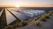 © Jai Izzam - Solar panel farm and battery storage containers at sunset