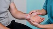 © Komang - Carpal tunnel syndrome, doctor and patient with wrist pain for medical examination, nerve damage and anatomy. Orthopedic specialist, hand injury and healthcare with physical therapy for treatment