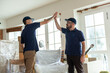 © Rawpixel.com - Movers celebrating successful home relocation.