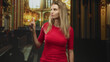 © Krakenimages.com - Woman points finger in ornate church building wearing red shirt with visible hand gesture; confidence.