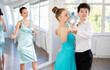 © JackF - Girl and a boy in festive clothes learn to dance tango under guidance of a teacher