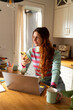 © Alba Vitta Studio/Stocksy - Woman works from home laptop and phone