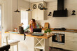 © Alba Vitta Studio/Stocksy - Woman Works at Home With Cat Kitchen