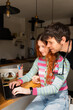 © Alba Vitta Studio/Stocksy - Couple Working Together at Home in Kitchen