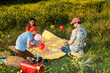 © Alba Vitta Studio/Stocksy - Friends Enjoy a Picnic With Balloons in a Flower Field