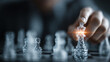 © Mamtaz - Hand moving chess piece on reflective board with strategic focus and competitive gameplay
