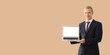 © Pixel-Shot - Young businessman holding laptop with blank screen, digital presentation and technology concept, isolated on solid background