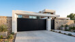 © Waqas - A luxurious modern villa entrance featuring a massive matte-black sliding gate framed by a sleek white concrete structure, natural stone boundary walls, wide light-gray stone driveway, minimalist arch