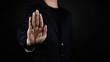 © WICHAI - Business professional showing a stop hand gesture, symbolizing prohibition, rejection, security, compliance, risk prevention, fraud protection, privacy control, warning, boundary setting.