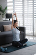 © mojo_cp - Young asian woman attractive exercises workout at home