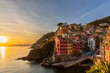 © Westend61 - Italy, Liguria, Riomaggiore, Edge of coastal village along Cinque Terre at sunset