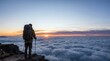 © Maria - traveler with backpack from behind on mountain peak watching beautiful sunrise