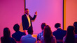 © Lustre Art Group  - Male presenter pointing to blank screen while addressing seminar audience. Concept of business workshop, corporate training, public speaking, leadership coaching and professional presentation.