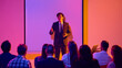 © Lustre Art Group  - Confident male presenter leading business seminar with audience in neon light. Concept of leadership talk, executive workshop, professional training, corporate event and motivational speaking.