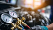 © KotBaton - Professional automotive air conditioning diagnostic gauges connected to vehicle engine. Car maintenance, repair service and HVAC system inspection in modern auto workshop.