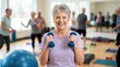 © Proshanto Mondol - Active Senior Fitness Class: A smiling senior woman confidently lifts dumbbells in a bright fitness studio, surrounded by other active seniors participating in a group exercise class.