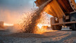 © Anastasiya Ri - Road construction material pouring from heavy truck during infrastructure works at sunset creating dynamic industrial transportation and development scene