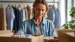 © Jane_S - Woman packing clothing boxes in small boutique behind rack