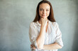 © Davor - Confident young woman posing in studio with thoughtful smile