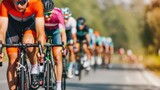 A group of cyclists in colorful racing uniforms and helmets pedals intensely on an open road under bright sunlight showcasing speed and athleticism