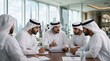 © DailyLens Studio - A group of Middle Eastern professionals in traditional clothing collaborating in a corporate environment
