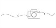 © SS line art - Illustration of a photo camera, made in one continuous line. Minimalistic drawing of a camera for travel and photography in the style of one line art. Vector illustration.