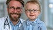 © CHAIYAPHON - Caring doctor with a smiling baby boy wearing adorable glasses and a bowtie