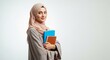 © mamasudhossen - Portrait of a smiling young muslim female student holding books