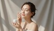 © postproduction - Woman Applying Cream on Face in Beauty Photo Shoot