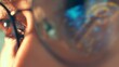 © Punyawee - A close-up of a person’s eye in glasses reflecting a digital key icon represents data security, privacy awareness, identity protection and the importance of digital access control in the modern world.