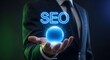 © Sonia - Seo optimization concept with businessman holding glowing orb