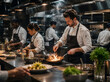 © dubogray1985 - Professional team of chefs working together in a premium open restaurant kitchen during dinner service.