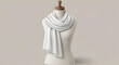 © joe - White scarf draped on a mannequin in a neutral studio setting. Elegant accessory display for fashion retail catalog or online store.