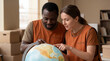 © Pei - World Refugee Day volunteers examining globe showing global humanitarian care teamwork support for charity awareness campaign poster design