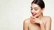 © Oleg Gekman - Beautiful Young Woman with clean fresh skin. Girl beauty face care. Facial treatment. Cosmetology, beauty and spa. Red nails manicure