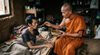 © logonv - Buddhist monk feeding a sick man in a poor house. Asian monk helping a patient with food. Concept of care, compassion, kindness, support, charity, and humanity in difficult life conditions.