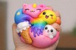 © Ева Поликарпова - A person's hand cradling a bundle of soft and cuddly squishy toys, suitable for use in lifestyle or product images