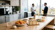 © Georgiy - Two businessmen having conversation in office kitchen with healthy Halloween snacks. Table featuring banana ghosts and orange pumpkins for festive corporate event celebration.