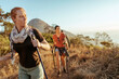 © Marko Geber - Friends hiking coastal mountain trail at sunset
