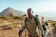 © Marko Geber - Friends hiking on coastal mountain trail on a sunny day