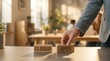 © Citra - Businessman placing wooden block with open and closed sign on desk in bright modern office representing business reopening